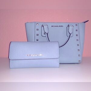 Michael Kors Baby blue crossbody/handbag and matching wallet.